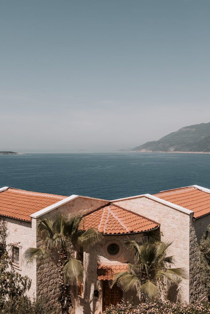 Charming villa in Antalya with red-tiled roofs and coastal views, embodying the Mediterranean essence.